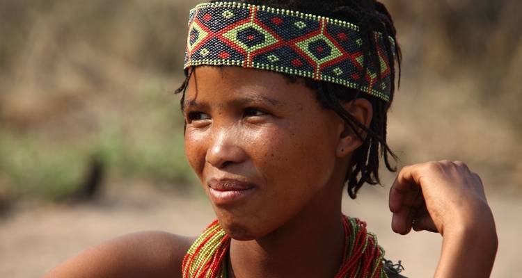 Close-up portrait of a person with a beaded headband.