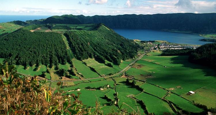 Aerial view of a mountainous landscape with a lagoon.