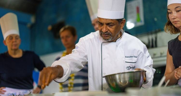 An executive chef teaching a cooking class.