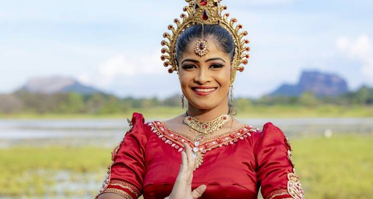 A woman in traditional dress performing a dance.