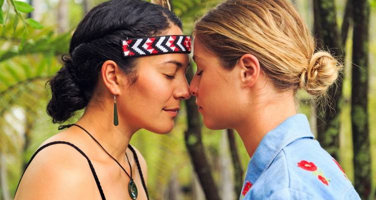 Two people engaging in a traditional greeting.