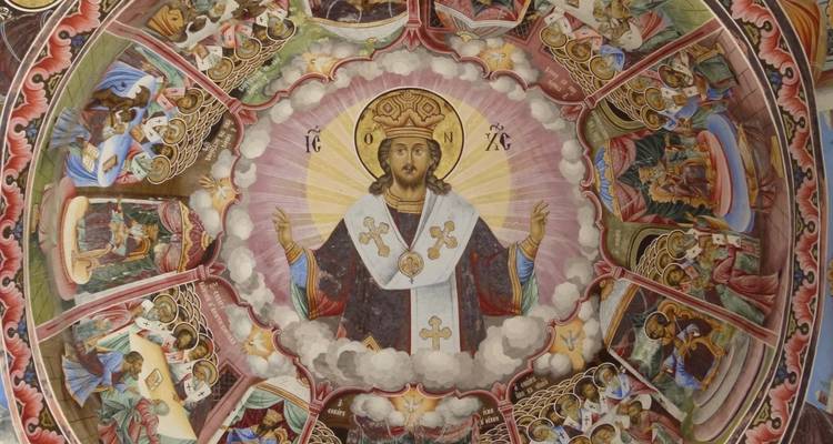 Colorful religious ceiling mural depicting Christ and biblical scenes.