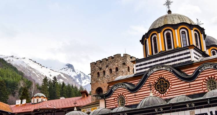 Close view of Rila Monastery with mountainous backdrop.