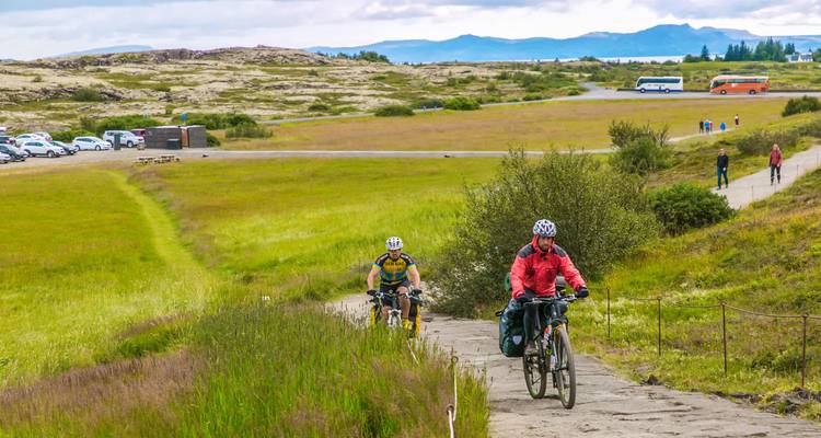 Cyclists on a path through Iceland's countryside