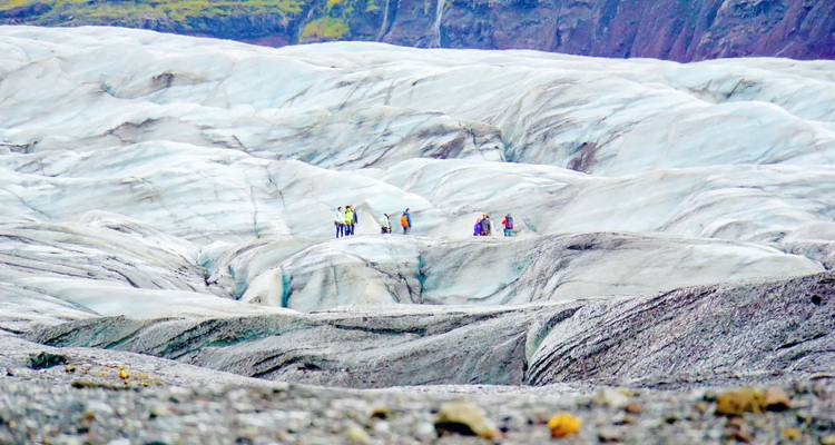 People exploring a glacier in Iceland