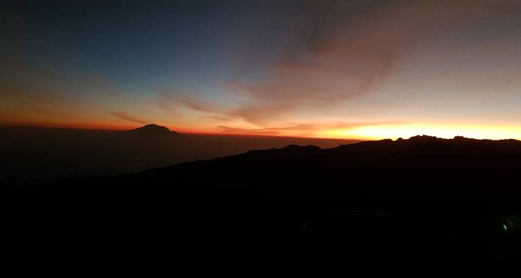 Silhouette of Mount Kilimanjaro at sunrise.