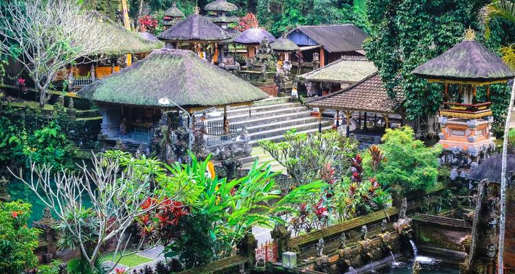 Traditional Balinese temple complex with lush greenery.