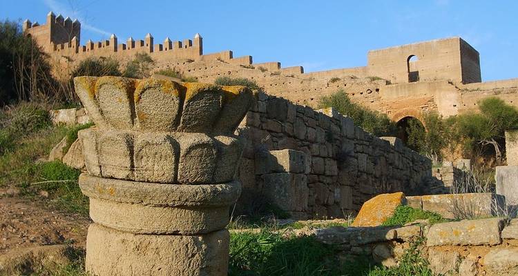 Ancient ruins with stone walls and carvings.
