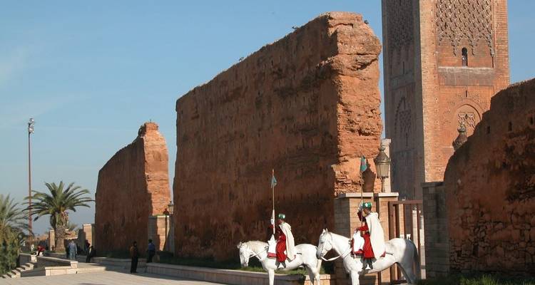 Hassan Tower with ceremonial guards on horses.