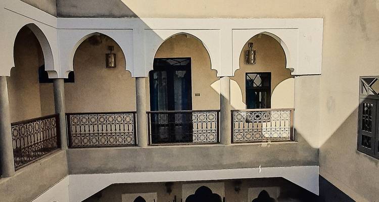 Interior courtyard with arches and windows.