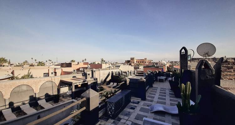 Rooftop view of a cityscape with clear skies.