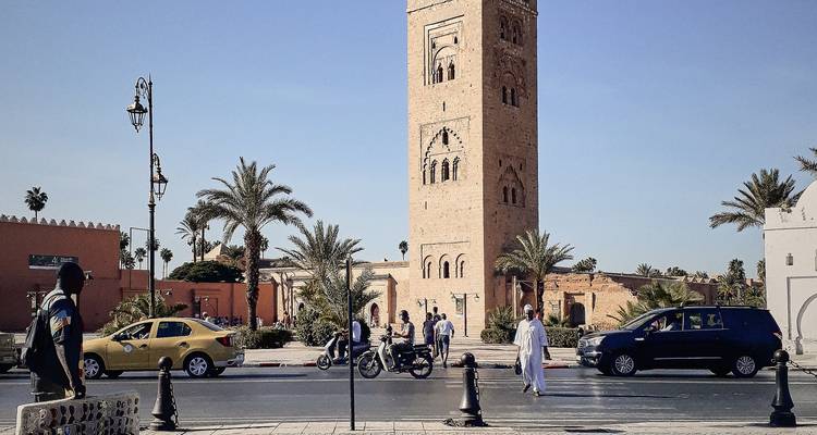Street scene with the Koutoubia Mosque tower visible.