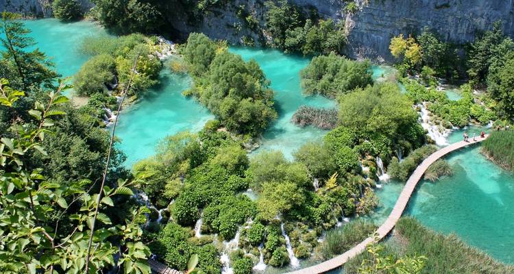 Beautiful aerial view of cascading lakes and lush greenery.