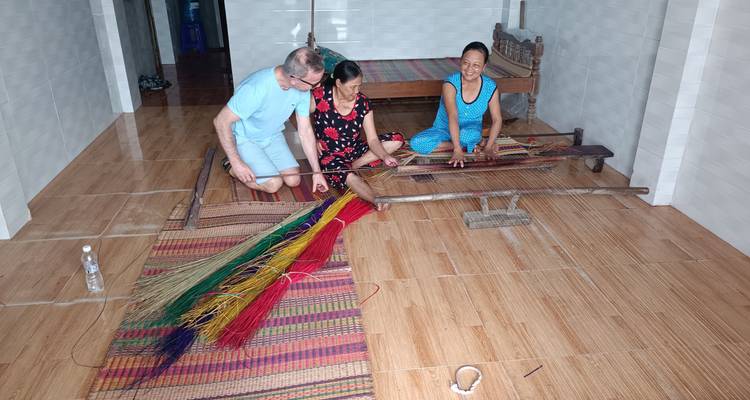 People working on weaving crafts.