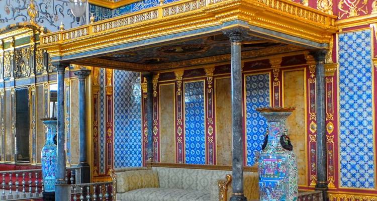 Ornate interior with vibrant tiles and a plush couch