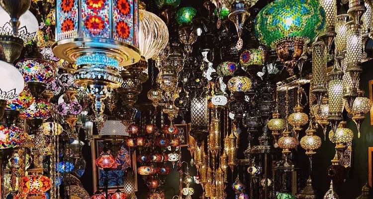 Vibrant mosaic lanterns displayed in a market setting
