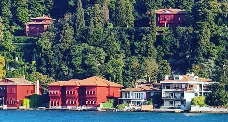 Scenic coastal view with red-roofed houses by the water