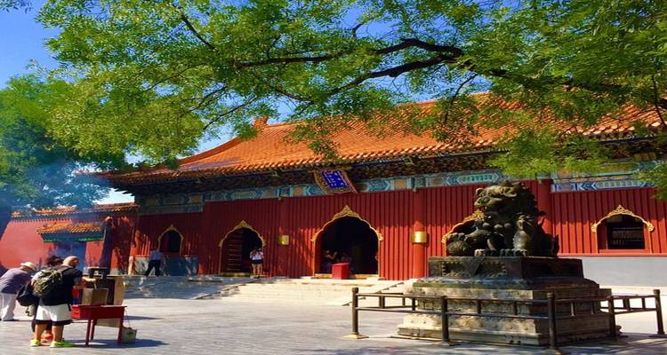 Traditional courtyard with statues, possibly a temple or historical site.