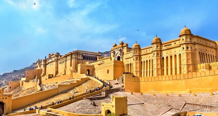 Historic amber-colored fort with extensive walls and decorative accents.