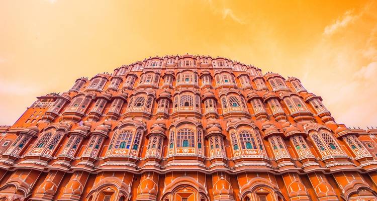 Grand facade of Hawa Mahal with rows of ornate windows.