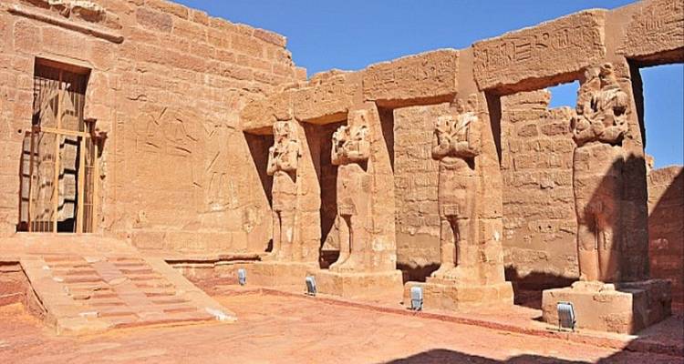 Interior of an Egyptian temple with statues