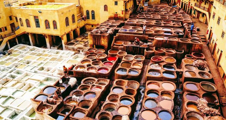 Traditional dye pits in a vibrant courtyard.