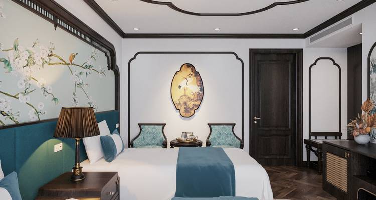 Goed ingerichte hotelkamer met turquoise accenten en moderne meubels.