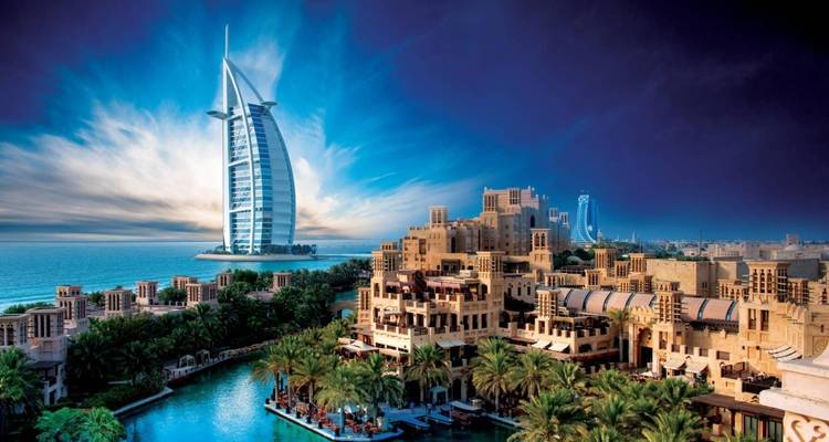 Iconic skyline with Burj Al Arab and surrounding architecture.