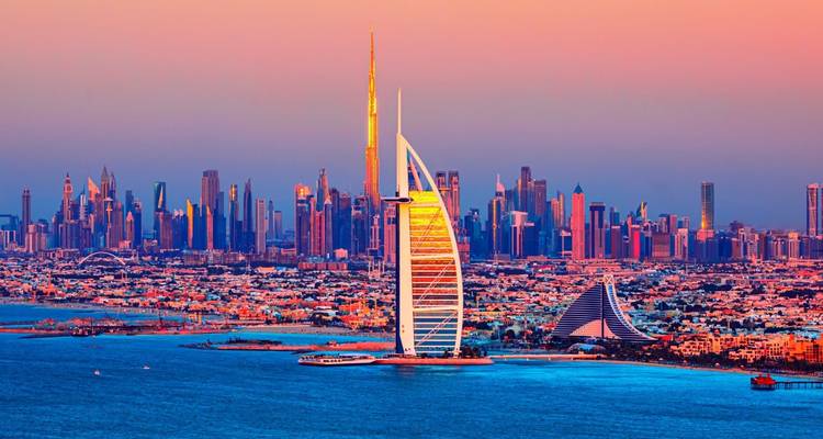 Dubai skyline with Burj Khalifa at sunset.