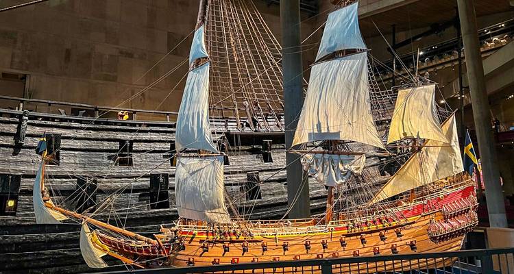 Model of a historical ship with detailed sails and rigging.
