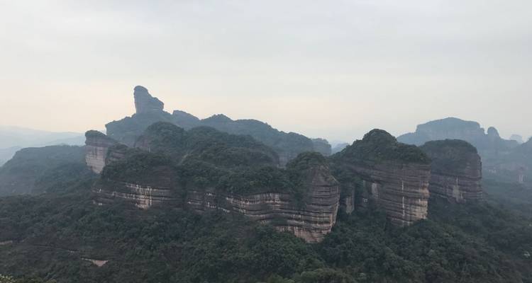 Panoramic view of a mountain range with unique rock formations.