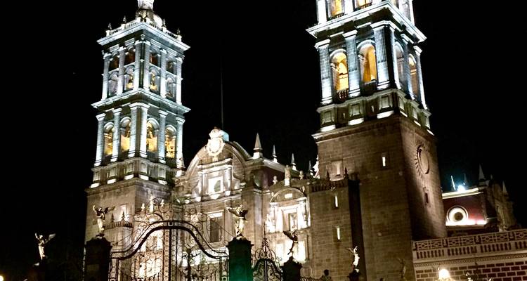 A cathedral beautifully illuminated at night.