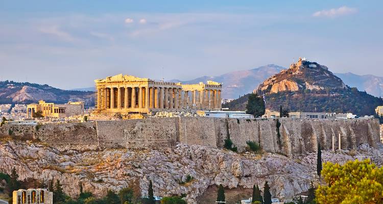 Acropolis with distant mountain backdrop, Athens cityscape.