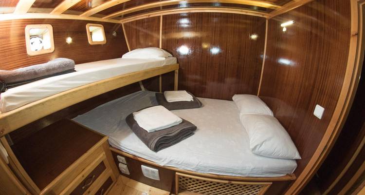Bunk bed setup in a wooden cabin.