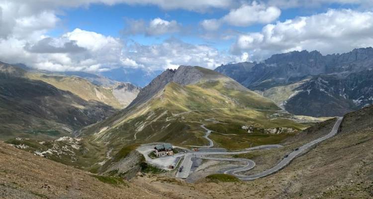 Wide view of a mountainous landscape with roads.