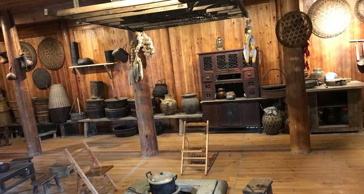 Traditional wooden interior with various household items on display.