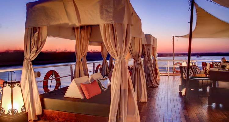 Luxurious lounge on a Nile cruise during sunset.