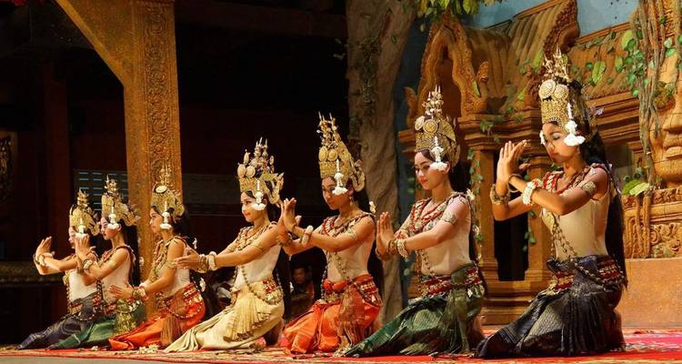 Traditional Khmer dancers in ornate costumes performing.