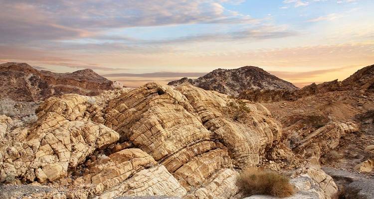 Rocky desert landscape during sunset with interesting formations.