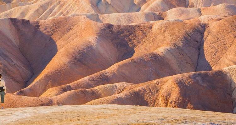 Colorful eroded hills in a desert landscape.