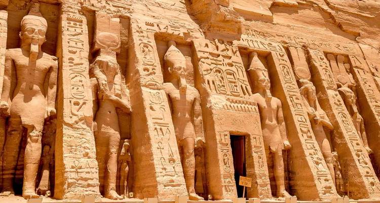 Carved stone statues on an ancient temple facade.