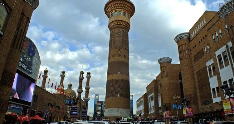A vibrant market area with minarets and architectural designs.