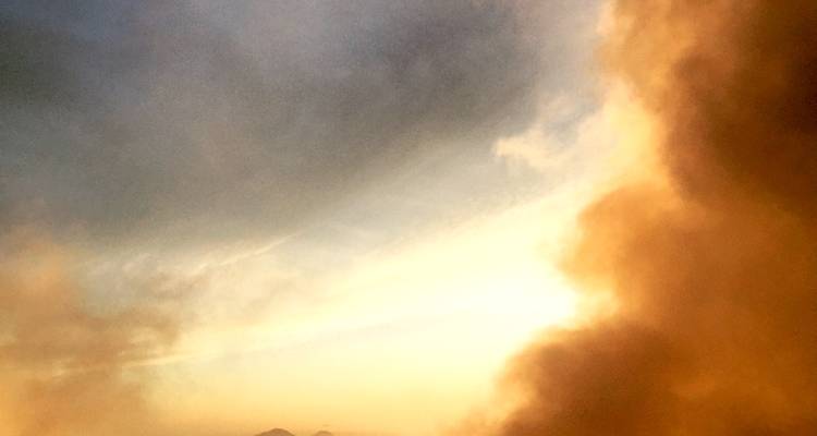 Smoky view with a sunset sky.
