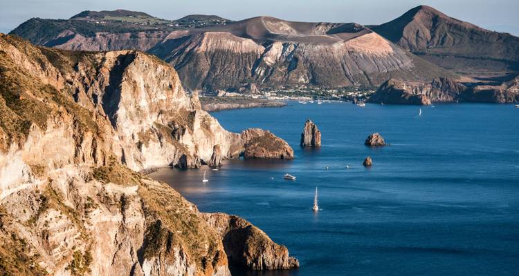 Dramatic coastal landscape with volcanic cliffs.
