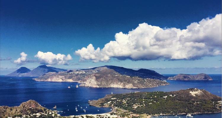 View of multiple islands with a cloudy sky.