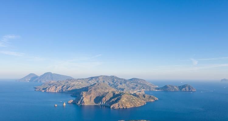 Aerial view of islands surrounded by blue sea.