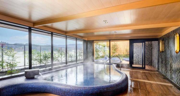 Spa with a hot tub overlooking a scenic view.