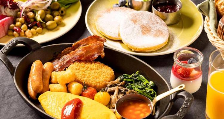 Close-up of a variety of breakfast foods on a table.
