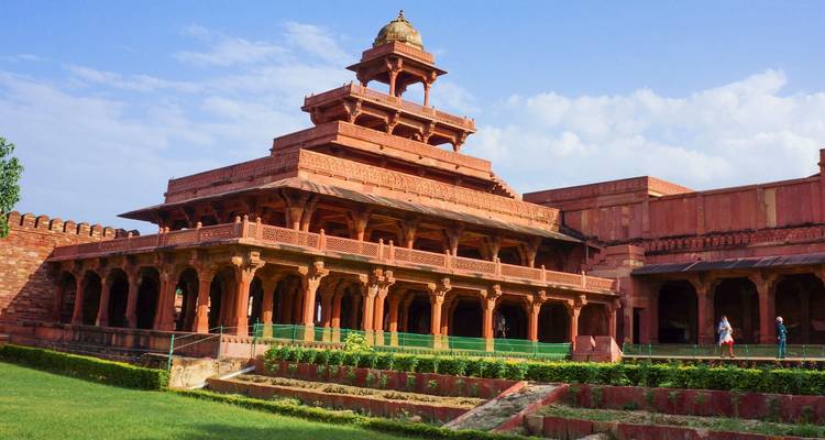 A well-preserved ancient red sandstone structure with intricate details.