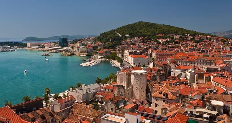 Aerial view of a charming coastal city with a marina